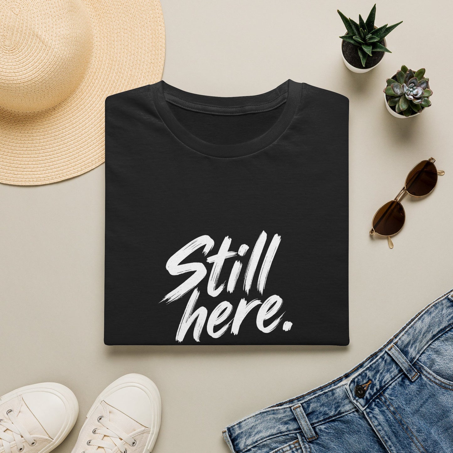 Still Here. Surprisingly. — Unisex Tee